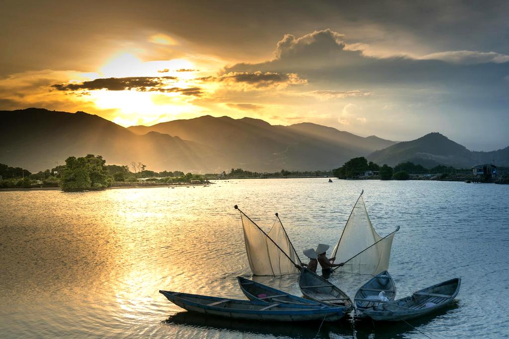 Sustainable fishing boats at sunrise